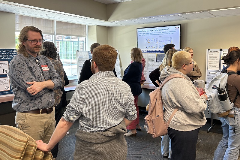UD faculty, staff, and students learn about new LGBTQ+ research at the event’s poster session.
