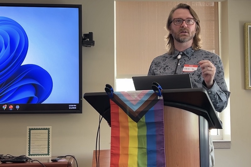 Assistant Professor Eric Layland gives opening remarks at the LGBTQ+ Research Symposium