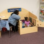 Maisha Carey and her daughter use the parent-child carrel in Morris Library’s newly opened Family Study Space.