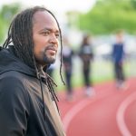 Antwain Flowers, a 2005 alumnus in human services, serves as director of youth development at West End Neighborhood House and coach of its Above Xpectations track team.
