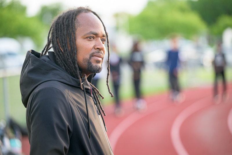 Antwain Flowers, a 2005 alumnus in human services, serves as director of youth development at West End Neighborhood House and coach of its Above Xpectations track team.
