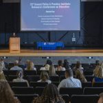 Alison Travers, associate director of the School Success Center’s Delaware Academy of School Leadership, introduces the 2025 Policy and Practice Institute at Dover High School.