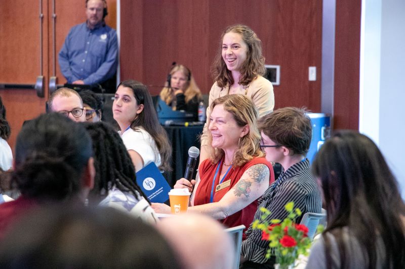Sara Goldstein, professor in the Department of Human Development and Family Sciences (HDFS), answers questions from graduate students about her research and the field at the 2026 Cross University Collaborative Mentoring Conference, hosted by UD’s College of Education and Human Development June 4-5. Rosa Mykyta-Chomsky, HDFS doctoral student, stands behind her.