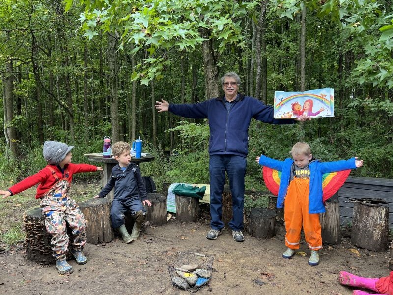 John Micklos, Jr. reads Sad, Mad, Glad: A Day Full of Feelings with children in the Lab School’s outdoor classroom.