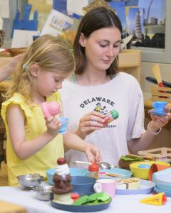 A UD education student plays with a preschooler at the Lab School. The Lab School also serves as a teaching and learning site for students, researchers and professionals.